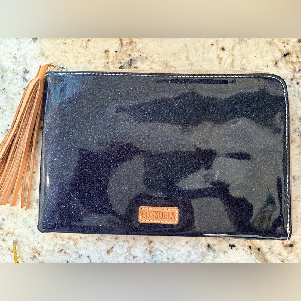 NWOT Consuela Navy Glitter clutch with Tan Tassel snake print on reverse side
